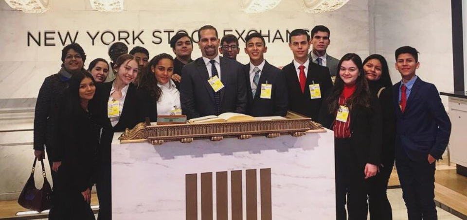 students and teacher at new york stock exchange